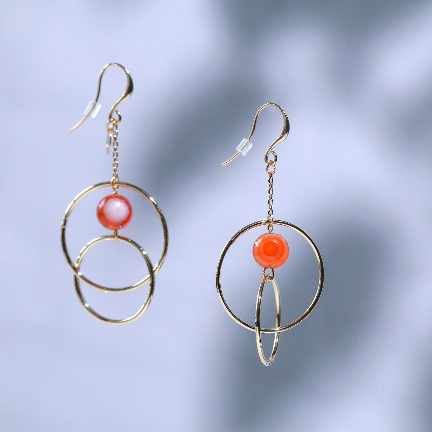 Metal hoop and orange gate earrings