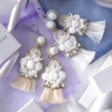 Pom pomotif x tassel earrings