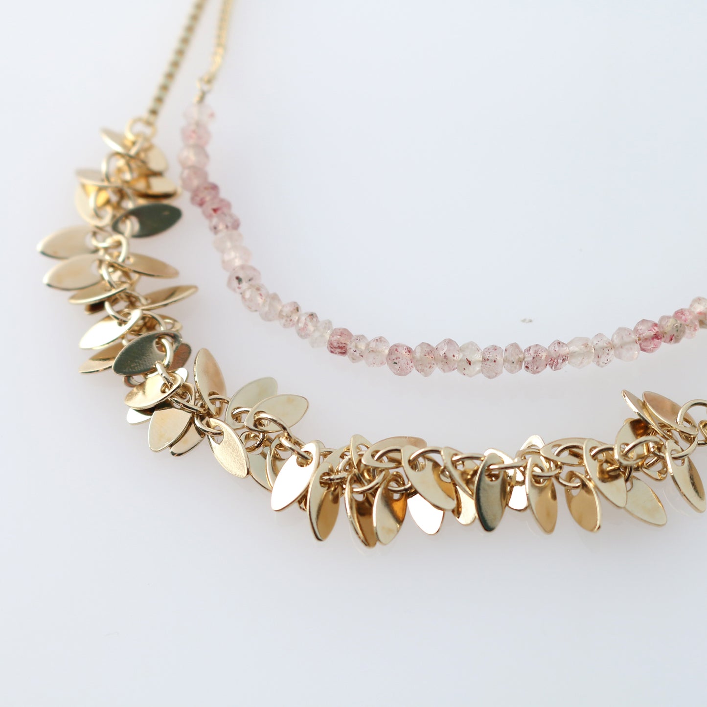 Two 3WAY necklaces with strawberry quartz and metal motifs