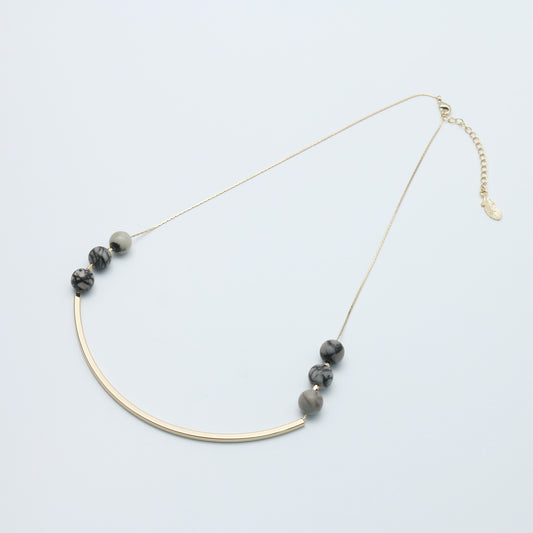 Long metal and natural stone -designed necklace